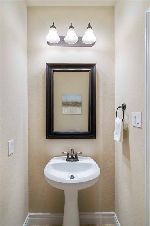 Downstairs half bath just off the family room.