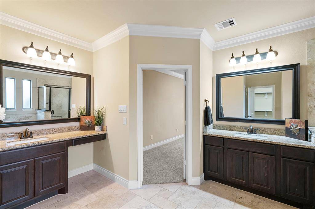 Primary bath has dual vanities keeping everyone in their lane!