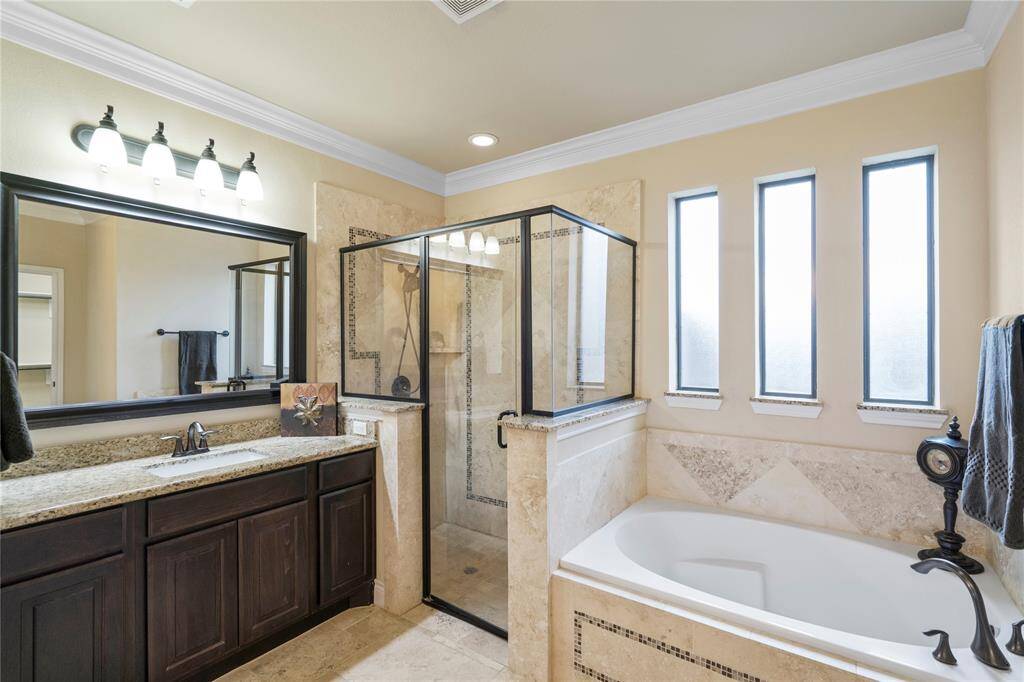 Stunning triple bath windows perfectly frame the soaking tub.
