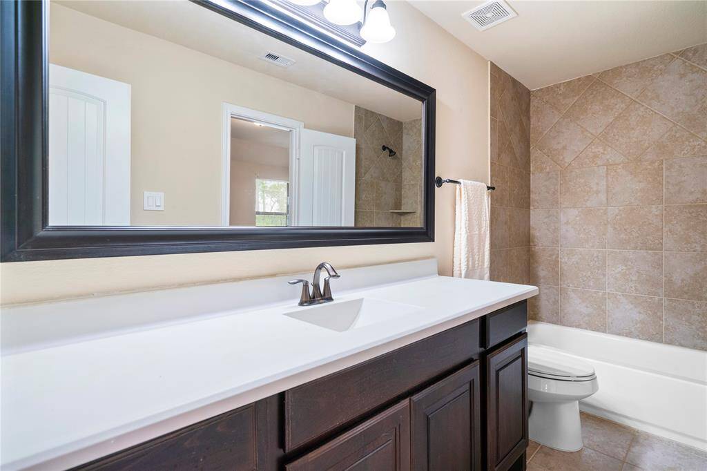 Full size spare bathroom upstairs immediately off the flex and spare bedroom.