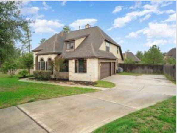 This driveway goes and goes. Nice extra large space just outside the 3 car garage. 3 point turns are simple.