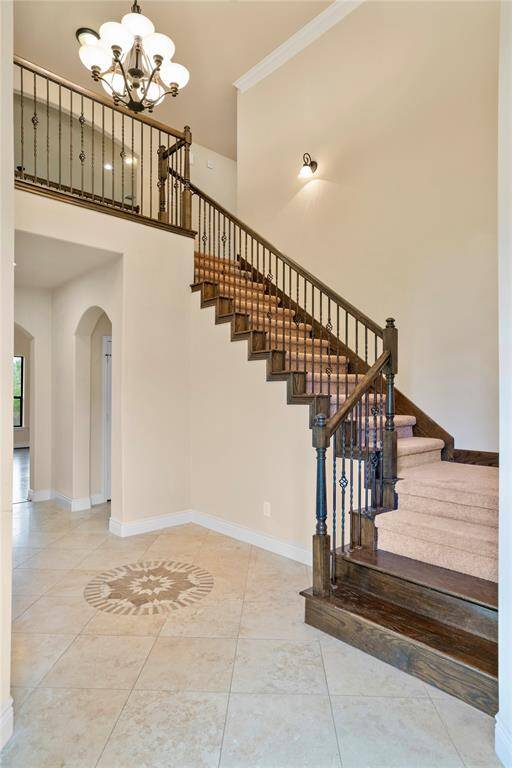 Upon entry is the dining room on the left and the home office with double glass doors on the right.