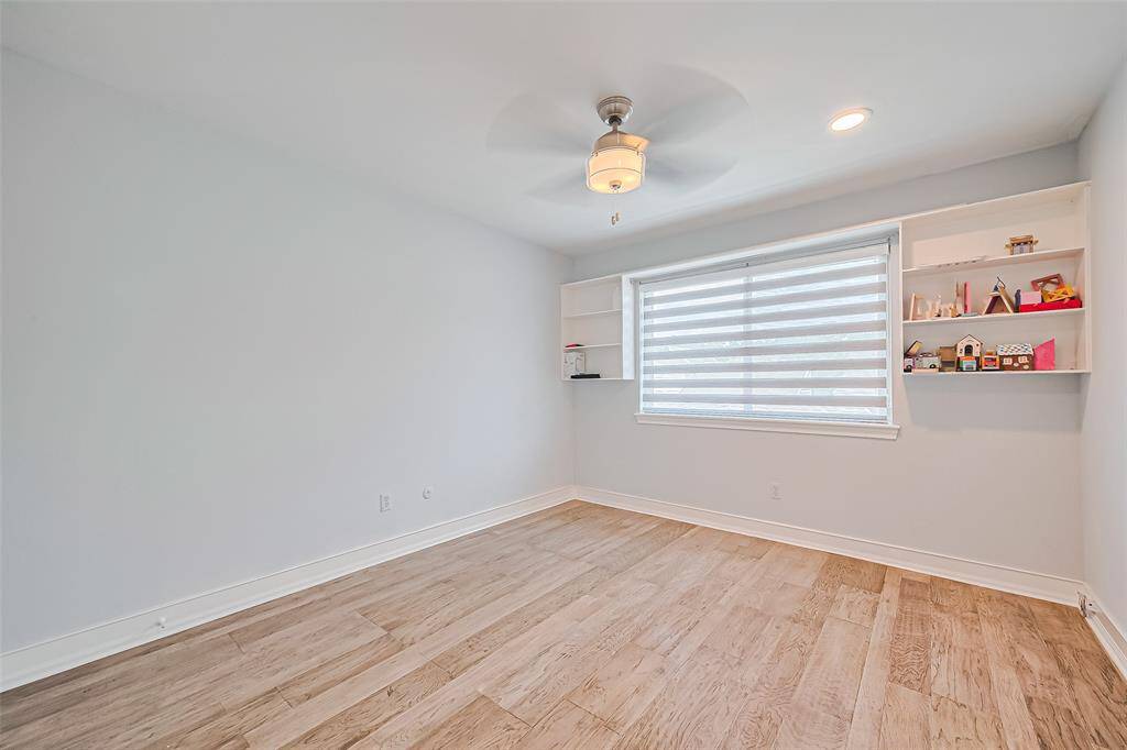Spacious secondary bedroom with ceiling fan & energy efficient lighting