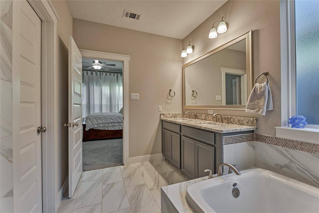 Upgraded Tile, countertops, backsplash & framed mirros