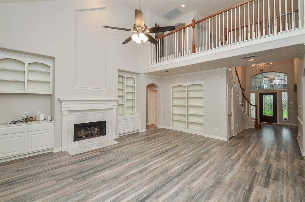 Main family area. Built in cabinets and a cozy fire place.