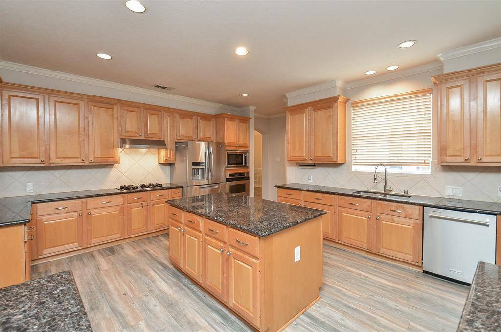 This kitchen has storage built in every space. A true chefs kitchen.