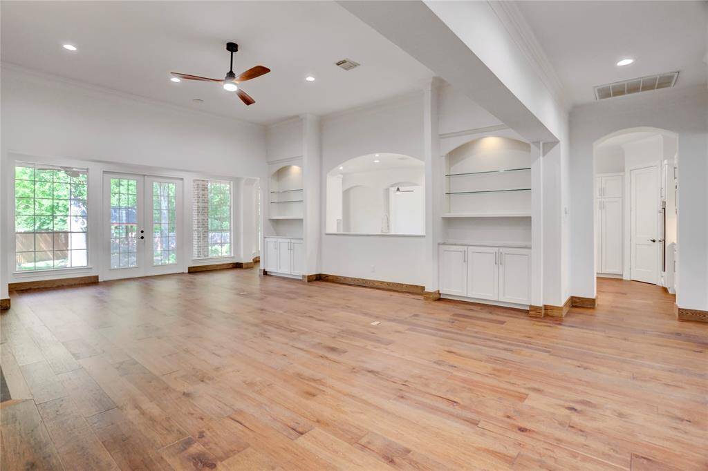Wall of windows and door to back yard.