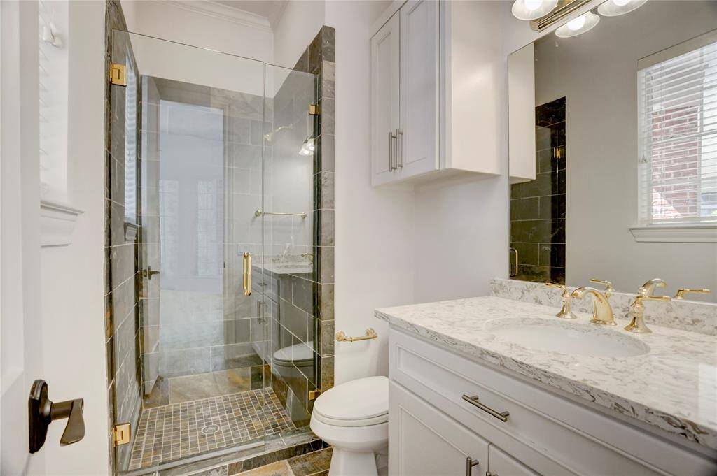 Full bath for sun room provides guest bedroom option.