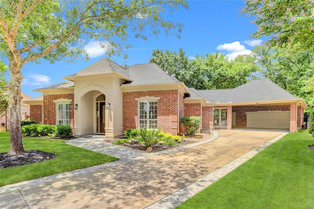 Two car garage + 2 car carport with wide driveway.