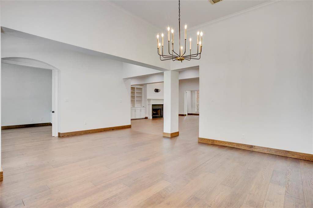 Engineered hardwoods throughout living areas.  Plenty of extra planks in garage for future repairs.