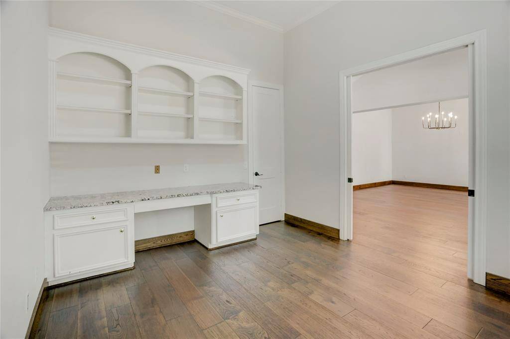 Built-ins plus walk-in closet and new ceiling fan in study.