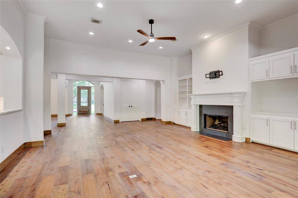 Open living areas with high ceiling.