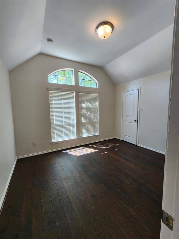 1st Bedroom with high ceilings and wood floors and lots of natural light