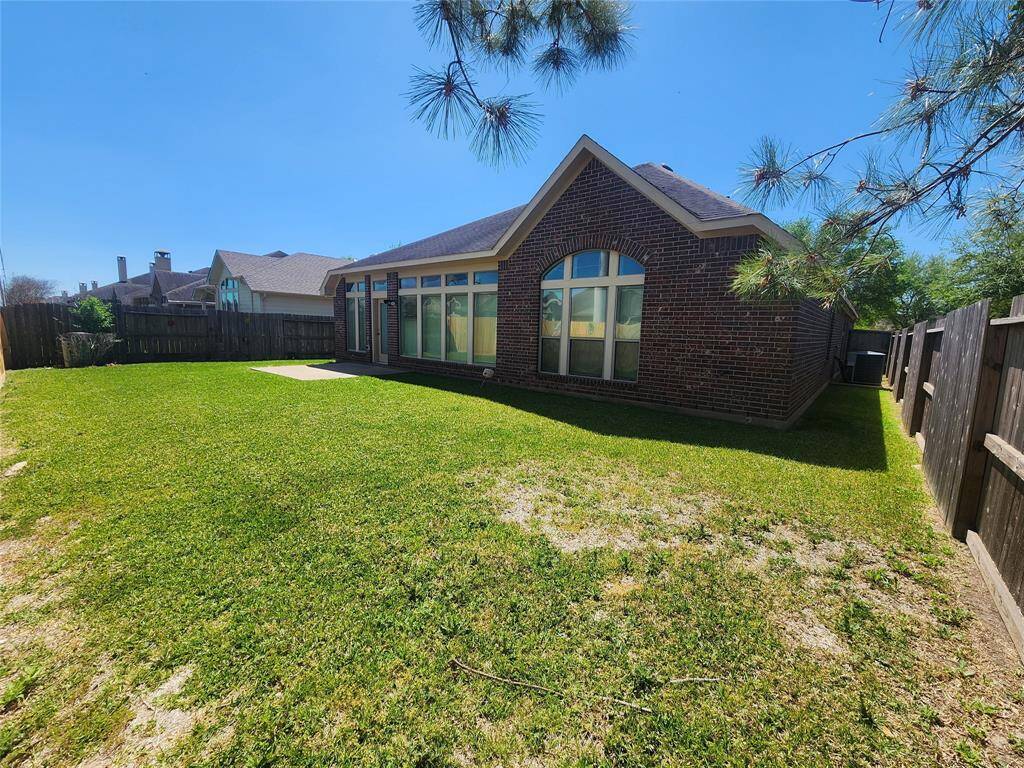 Rear yard. This is an all brick home