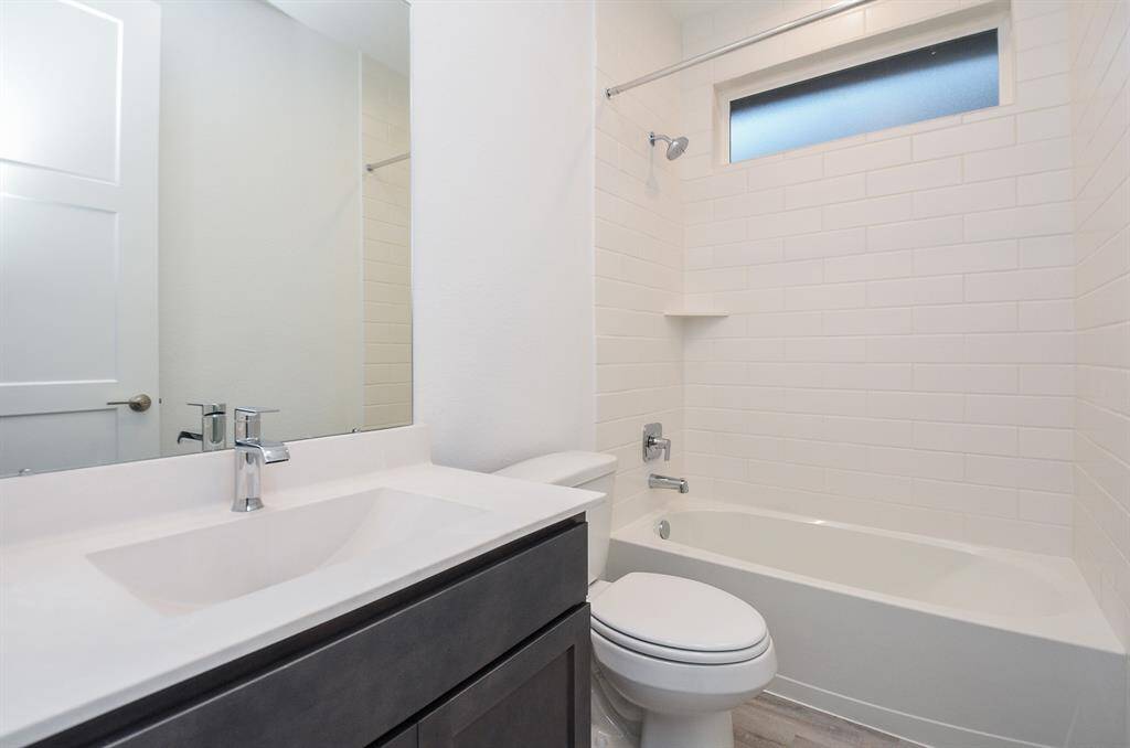 Full Bathroom 2 With Tile Surround To The Ceiling