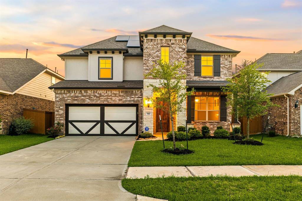 Welcome home to 142 Sunray Creek Drive on a quiet street in Sunterra and zoned to Katy ISD! This stunning home has lovely curb appeal, a well-manicured lawn, beautiful landscaping, stone/brick/stucco elevation, dark stained front door, covered front porch, traditional style, dark stained shutters, beautiful outdoor lanterns and a double wide driveway!