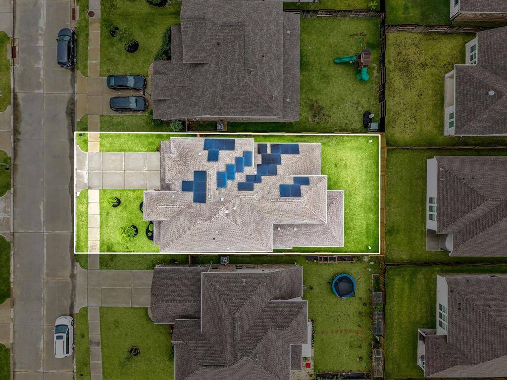 Amazing aerial shot of this gorgeous home situated on a quiet street in the sought after community of Sunterra zoned to Katy ISD. Lush landscaping, well manicured front lawn and a wonderful back patio perfect to set up, and an outdoor sitting area.