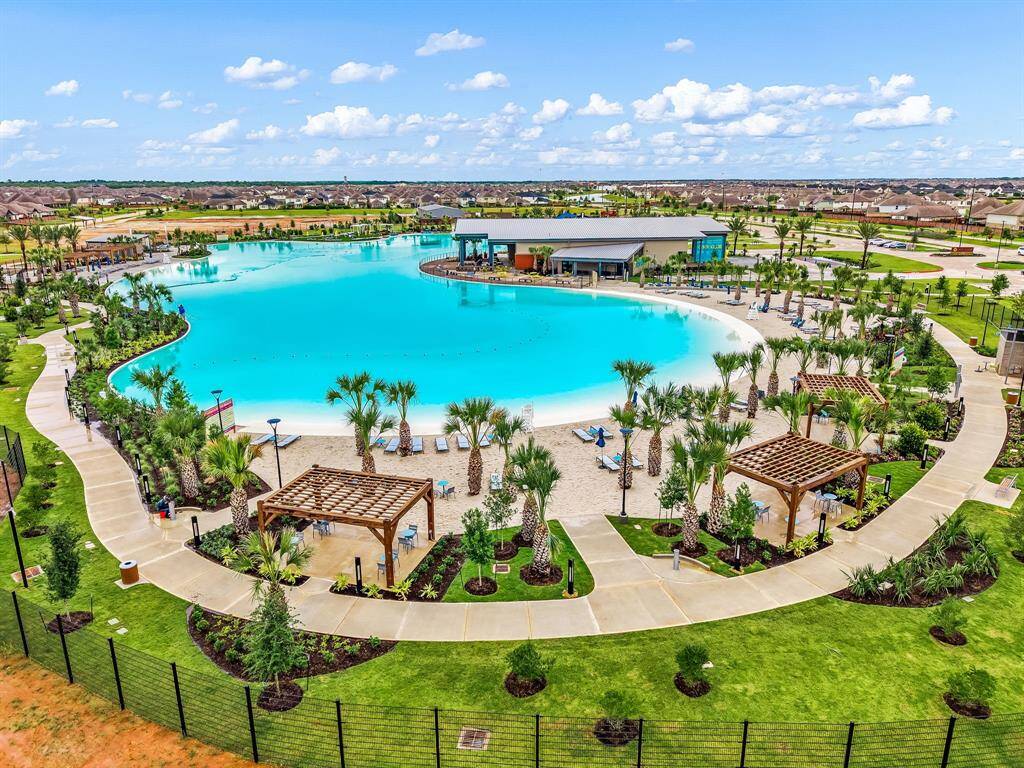 Sunterra also features scenic hike-and-bike trails, expansive green spaces, community parks, and playgrounds. Residents enjoy a variety of amenities including a state-of-the-art clubhouse, fitness center, sports courts, and resort-style pools—perfect for cooling off on sunny Texas days.