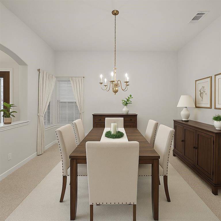 This formal  dining room features a cozy, elegant setting , a classic chandelier, and ample natural light