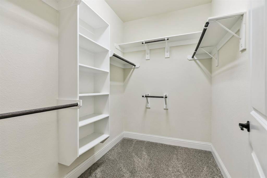 Powder room with decorative vanity and mirror.