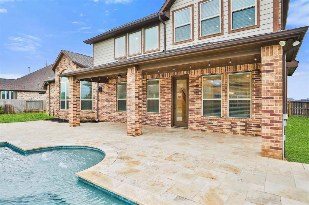 Cover porch/patio is large enough for outdoor seating and dining.