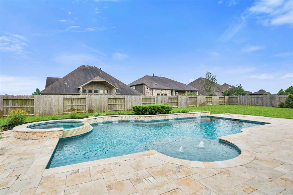 Large pool is 4 to 7 feet deep, with built-in 8 x 8 spa.