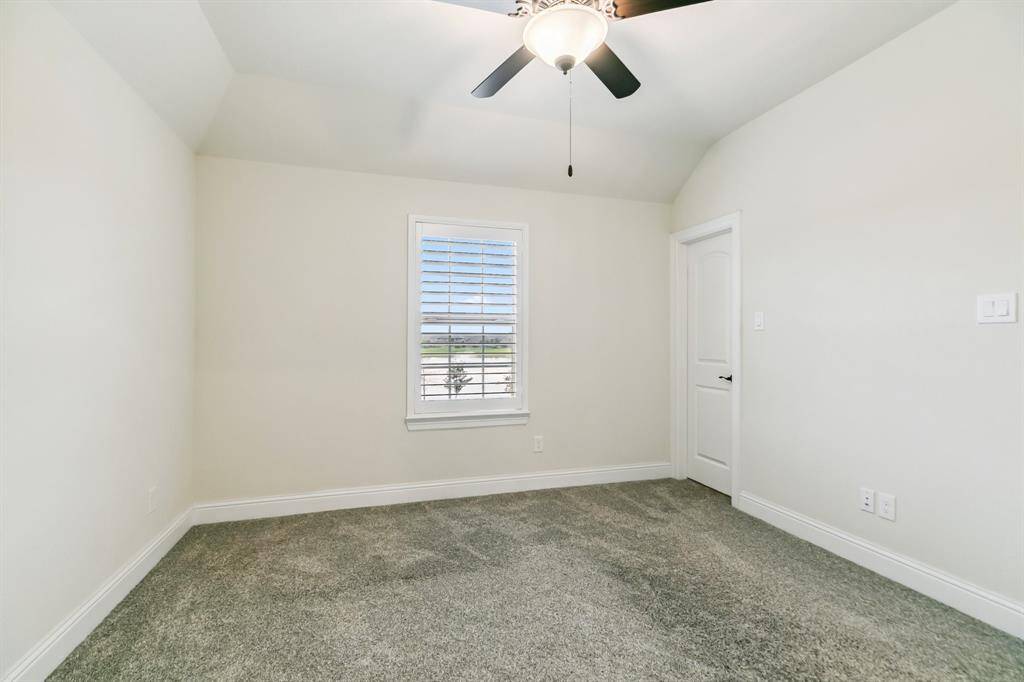 Pool has a large deck area to accommodate a fire pit, and has waterfall, and tanning ledge with fountains.