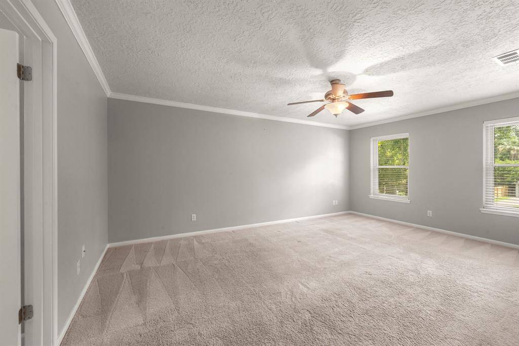 Spacious primary bedroom is located upstairs, keeping you close to the little ones while still offering a peaceful retreat of your own."