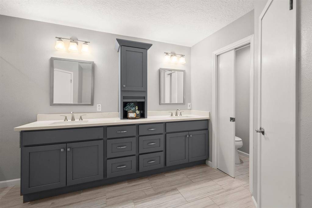 Cabinetry was thoughtfully designed with double sets of drawers and stylish countertop cabinet, offering both beauty and practical storage solutions.