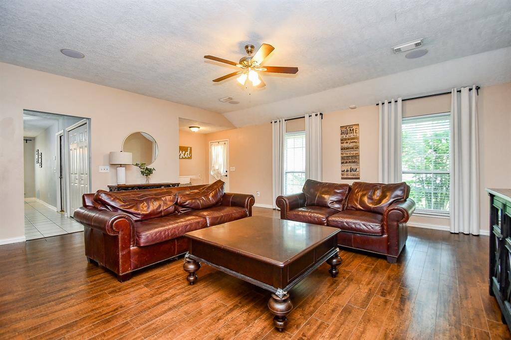A Spaacious Living Room with Low Maintenace, Gorgeous Vinly Wood Flooring