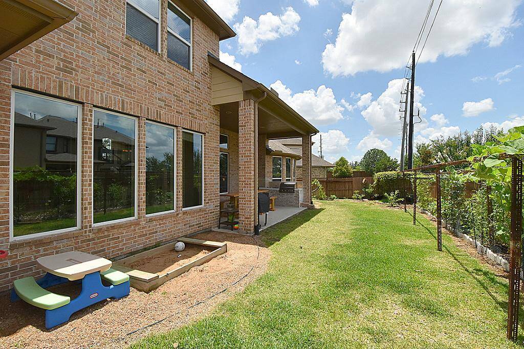 Another view of the back yard with organic vegetable and herbs garden!