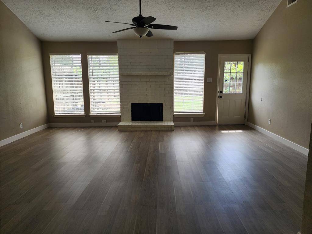 Family room with fireplace and door to backyard