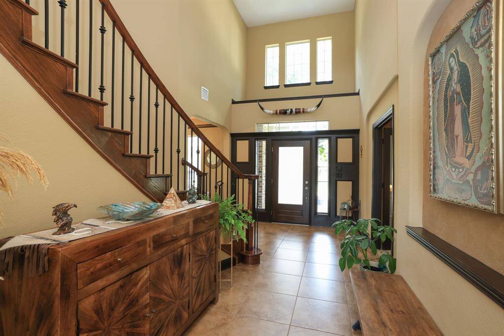 Don't miss the enhanced millwork around the entrance door with transom and sidelights
