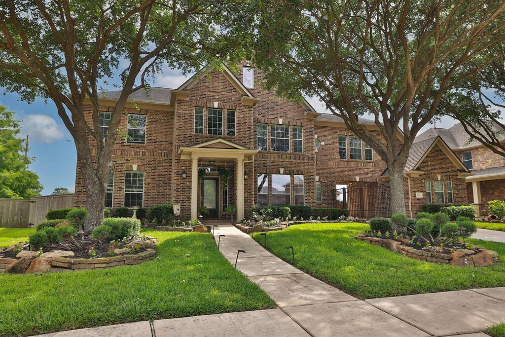 Sidewalk, mature trees, covered front porch