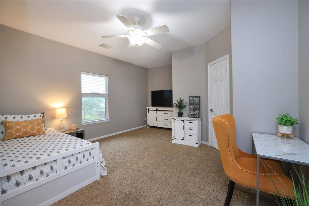 Bedroom 4 is the most spacious of all faces the side of the home.