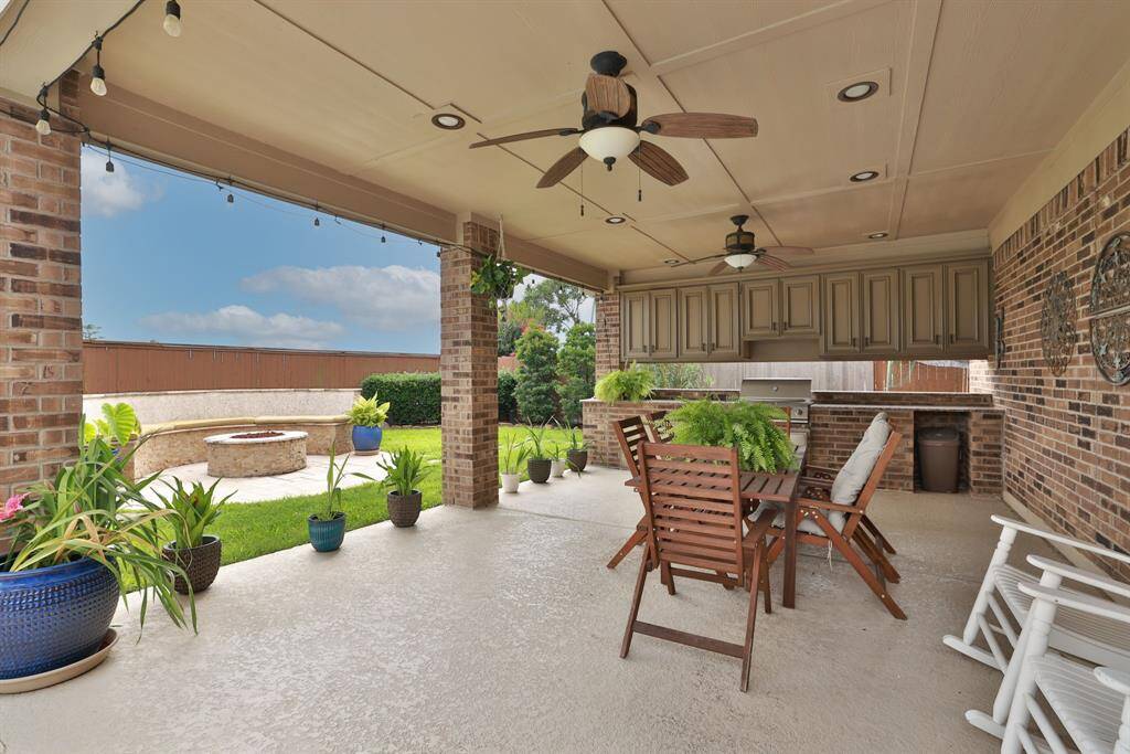 Patio with outdoor kitchen.Plenty of storage and overhead fans.