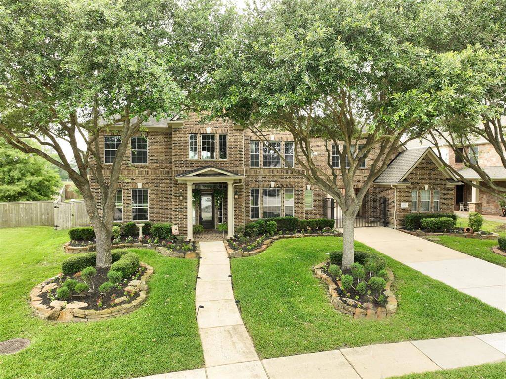 Aerial photo displays that the landscaping has been meticulously trimmed down so as to not cover the windows.