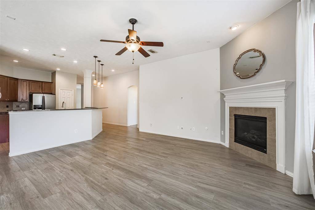 Open-concept den seamlessly connects to the kitchen, ideal for entertaining and family gatherings.