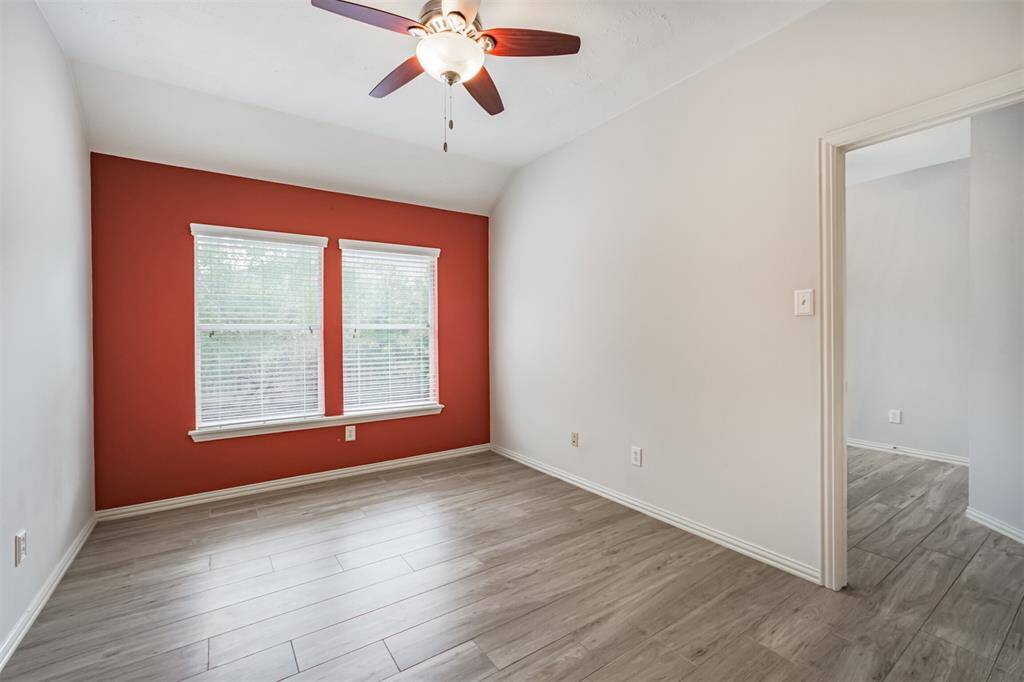 Gamroom with ceiling fan.