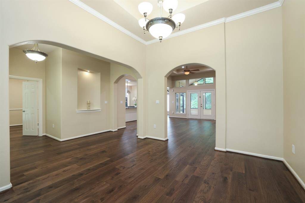To the right of the entry, you’ll find your formal dining space, a welcoming area perfect for hosting holiday dinners, special gatherings, or simply enjoying everyday meals in style. Its location offers a seamless flow into the main living and kitchen areas, ideal for entertaining.