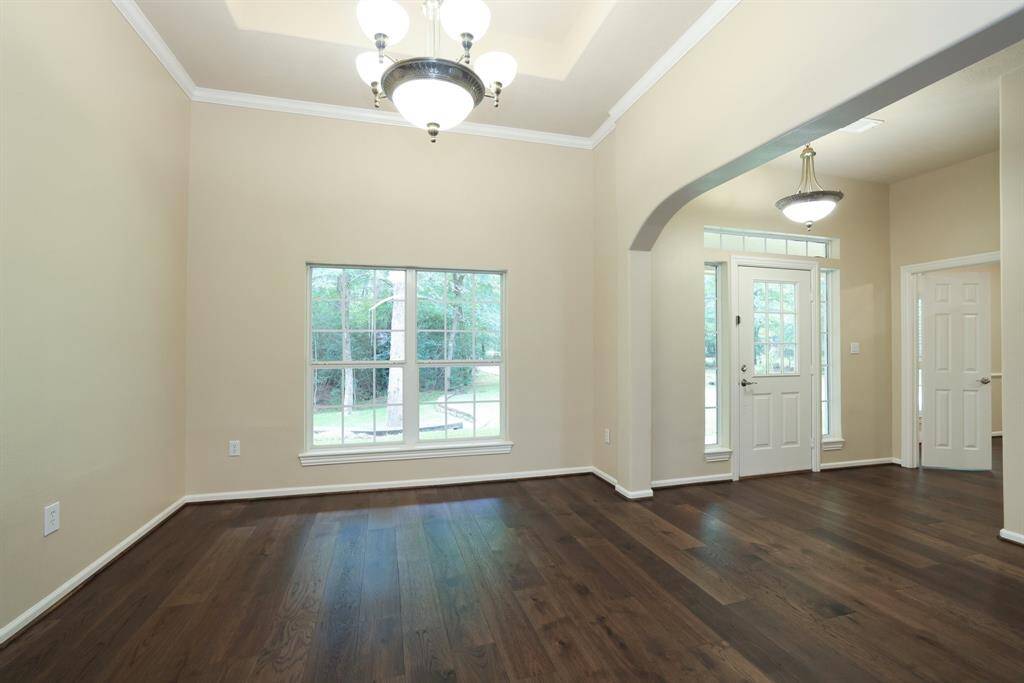 Enjoy open-concept living with a seamless flow between the kitchen, dining, and living areas perfect for entertaining or everyday comfort. Notice the beautiful wood floors throughout, adding warmth, durability, and a touch of elegance with no carpet in sight.