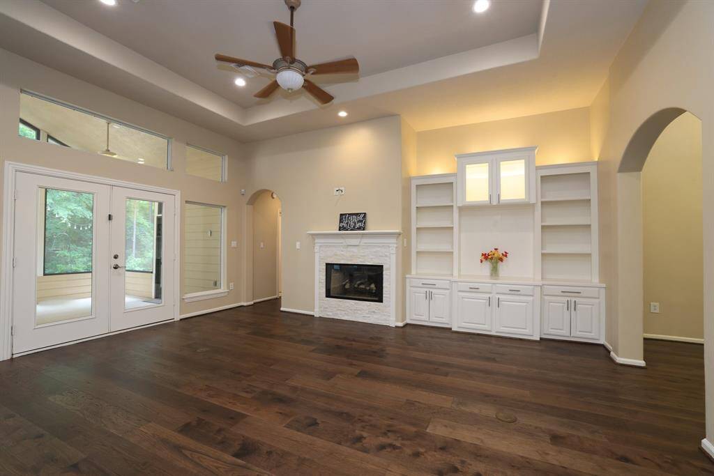 As you tour this home, notice the custom built-ins that add both charm and functionality. The gas log fireplace serves as the heart of the family living area, creating a warm, inviting space to gather, relax, and make lasting memories.
