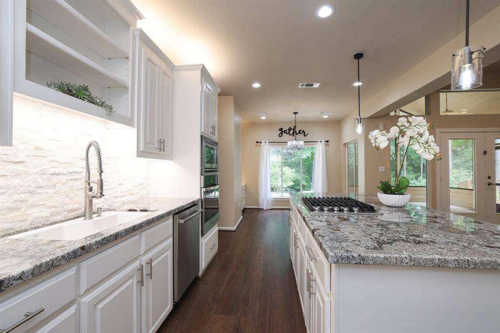 Enjoy beautiful updated kitchen finishes paired with thoughtfully placed lighting that creates the perfect ambiance, day or night. Whether you're cooking dinner or enjoying a quiet evening, the warm glow and stylish updates make this space as functional as it is inviting.