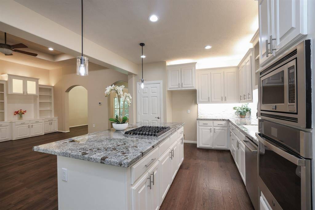 This beautifully updated kitchen shines with under and over cabinet lighting (2023), adding style and functionality. Enjoy cooking with the new gas cooktop (2020) and replaced microwave oven (2022)