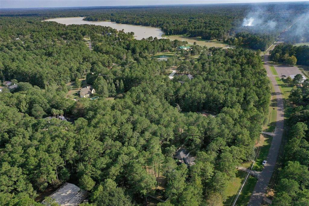 Welcome to Indigo Lake Estates - A 2,500± acre community offering spacious home sites from 1 to 17 acres. At its heart lies a stunning 160-acre private lake perfect for boating, fishing, and family fun. Residents also enjoy an array of outdoor amenities, including sand volleyball courts, soccer and baseball fields, and multiple parks. It's the ideal setting to relax lakeside, take a swim, or gather friends for a game of volleyball in this nature-filled retreat.