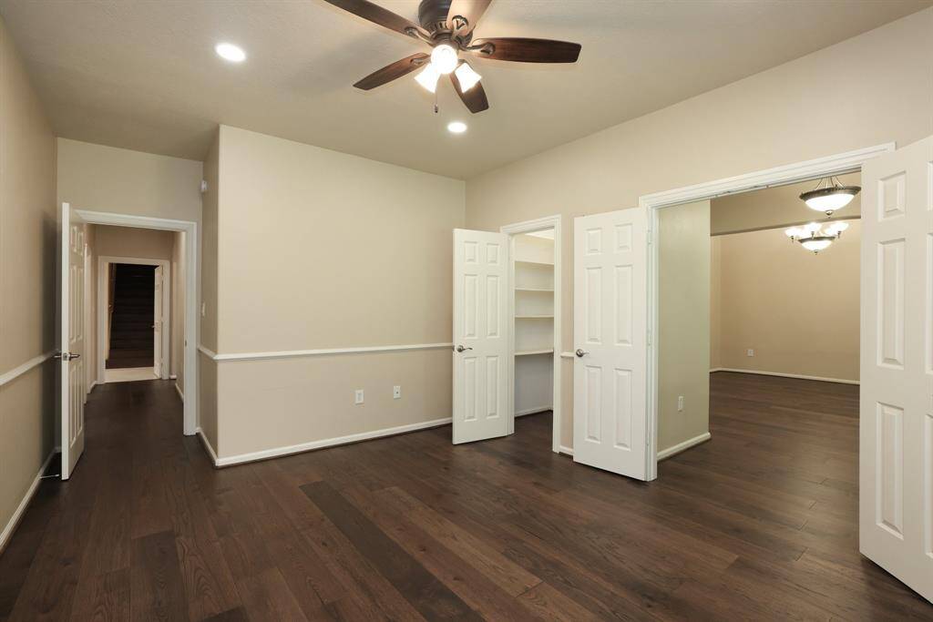 Versatile flex space with double-door entry off the foyer and an additional hallway entry, ideal as a bedroom, home office, or second living area. This room adapts easily to your needs, offering privacy, functionality, and flexibility.