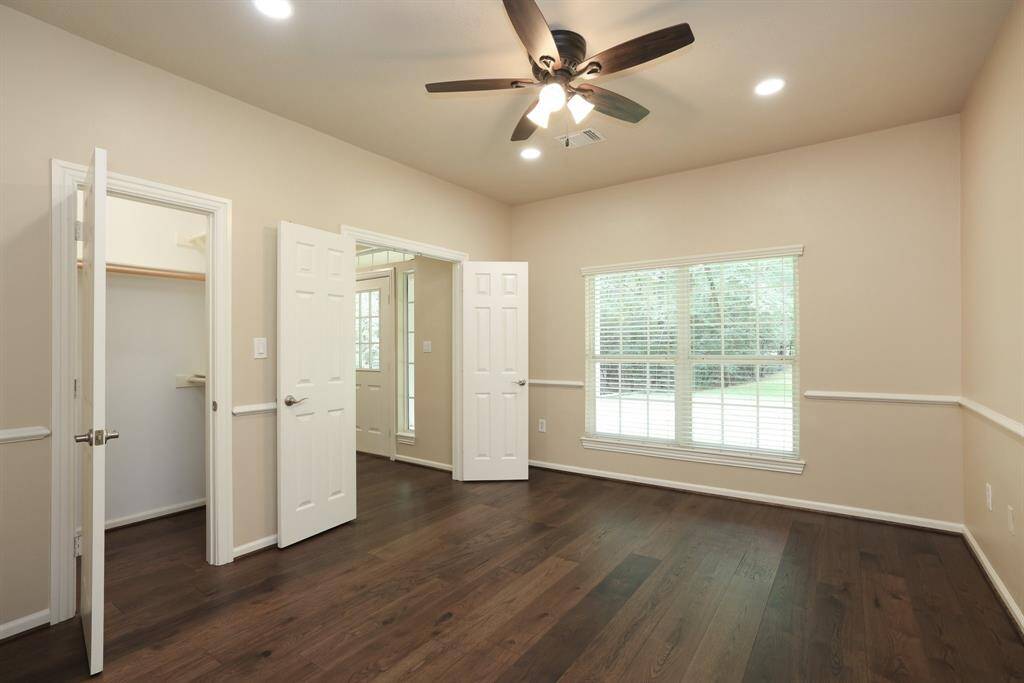 This flexible space overlooks the front of your nearly 3-acre lot, offering peaceful views and plenty of natural light. Whether used as a bedroom, office, or sitting room, it’s a bright and inviting spot with a scenic outlook.