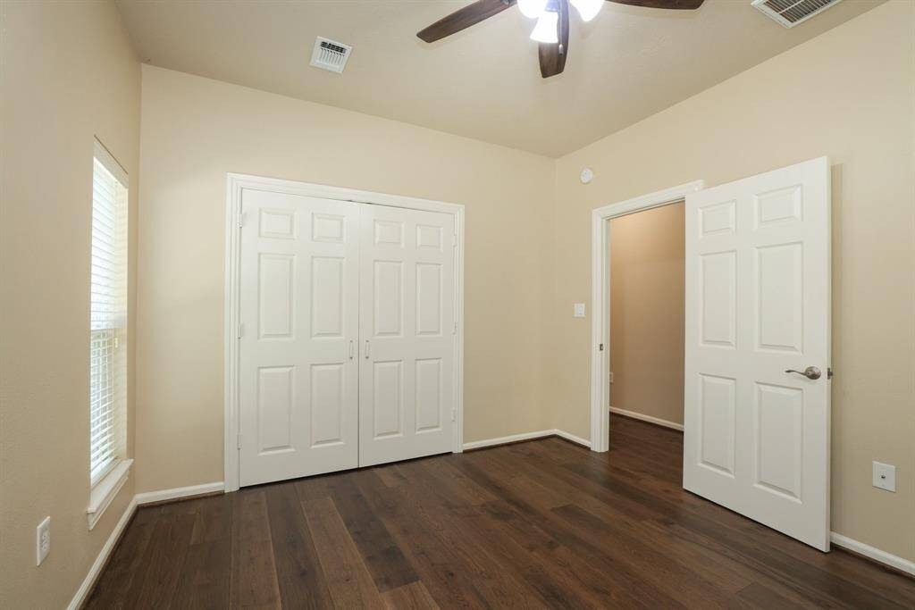 Notice the easy-care, updated flooring throughout, a blend of wood and hard surfaces that offer durability, style, and low maintenance. With no carpet, this home is as practical as it is beautiful.