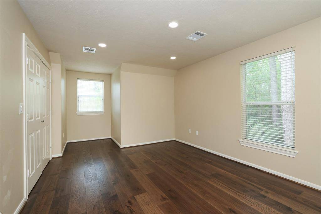 Gaze out through the soaring two-story windows and enjoy serene views of your private acreage.