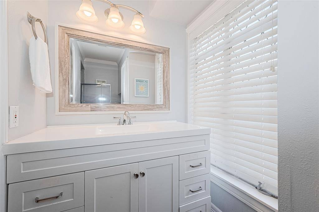 Bathroom has large windows for lots of natural lights.